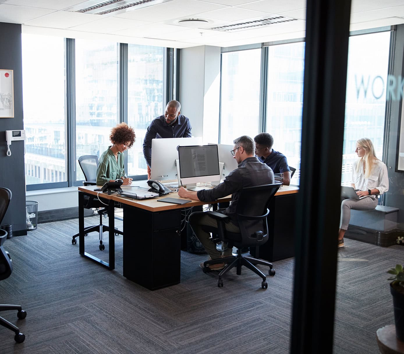 young creative team working together at computers