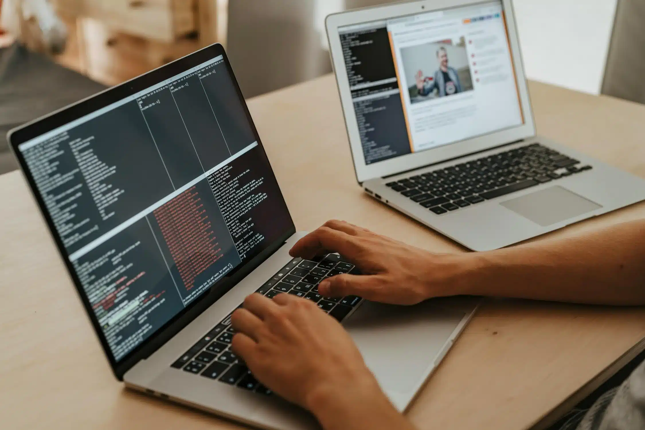 Someone is coding or programming on a laptop